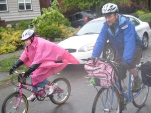 Clint bikes to school with daughter Berkeley 